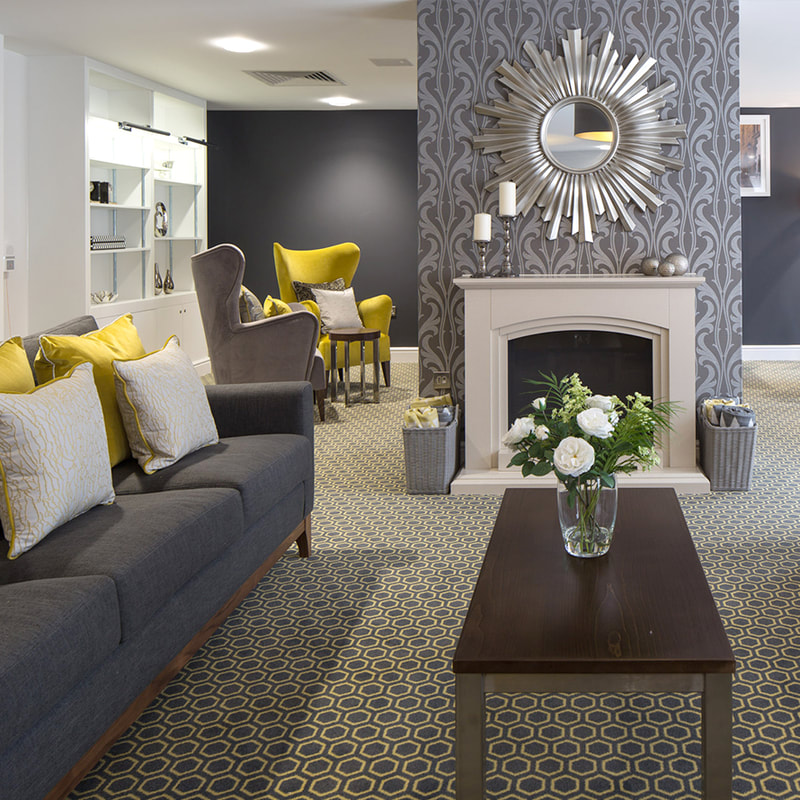Charcoal grey and yellow lounge, Grey and yellow carpet, charcoal grey feature wall