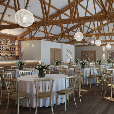 The Green wedding venue, in Barn. Feature bar, with fairy lighting, round tables and gold chairs.